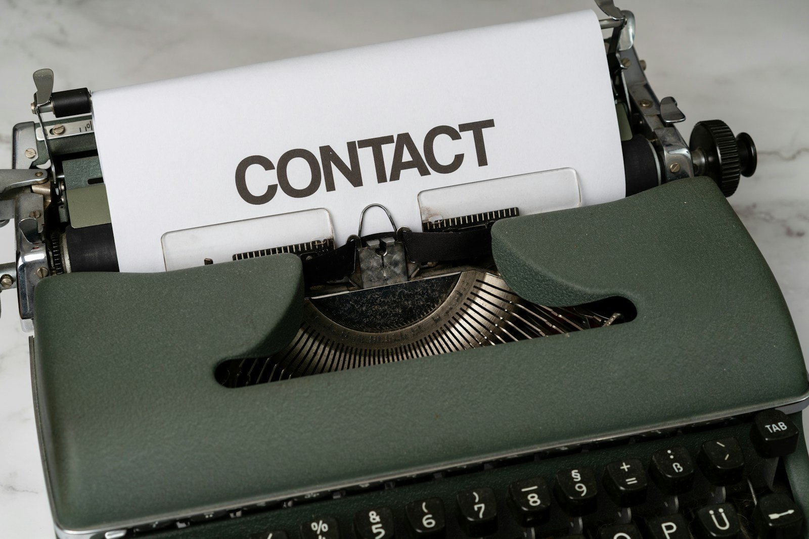 Contact Us a close up of an old fashioned typewriter