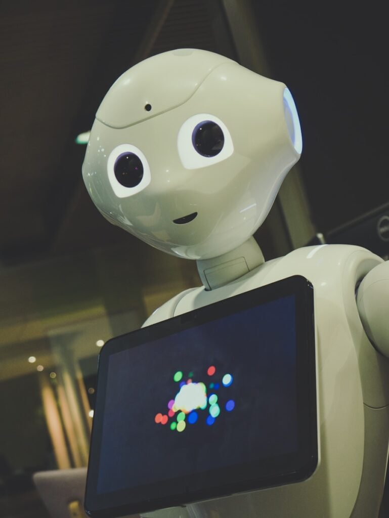 AI Denture Design: Reliable, or Different Every Time? white robot toy holding black tablet
